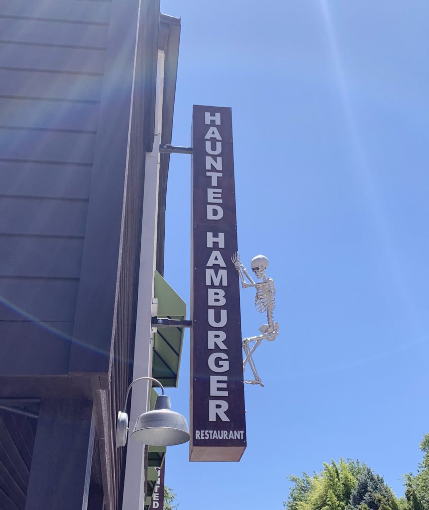 Skeleton on the sign at Haunted Hamburger in Jerome, Arizona, haunted restaurant in ghost town in Arizona