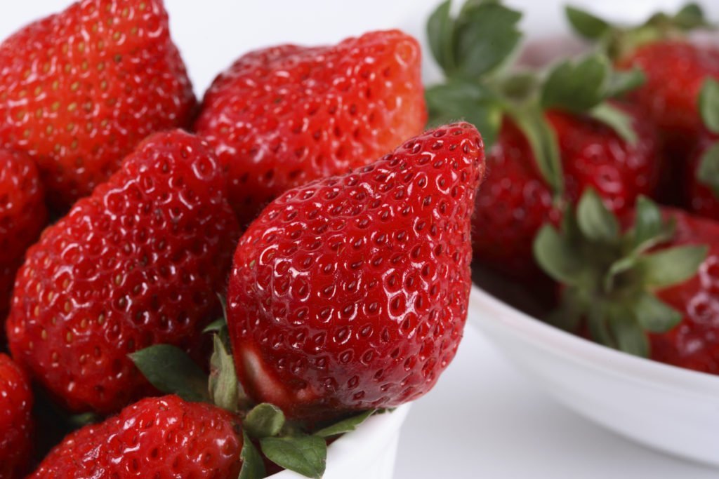 ripe red strawberries are top of the dirty dozen for produce, Kale and spinach high pesticide residue, dirty dozen produce, EWG dirty dozen 2019, environmental working group's dirty dozen 2019, buy organic, what fruit to buy organic, buy organic strawberries