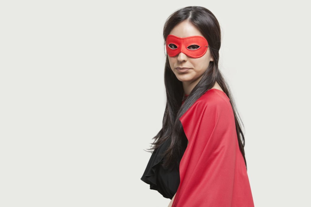 Young woman in superhero costume, once abused by a narcissist, now confident and brave in recovery