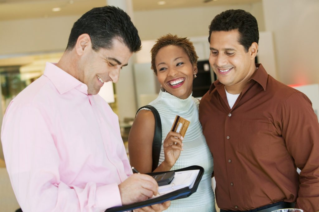 Couple paying attention to credit card balances to improve their credit score. 